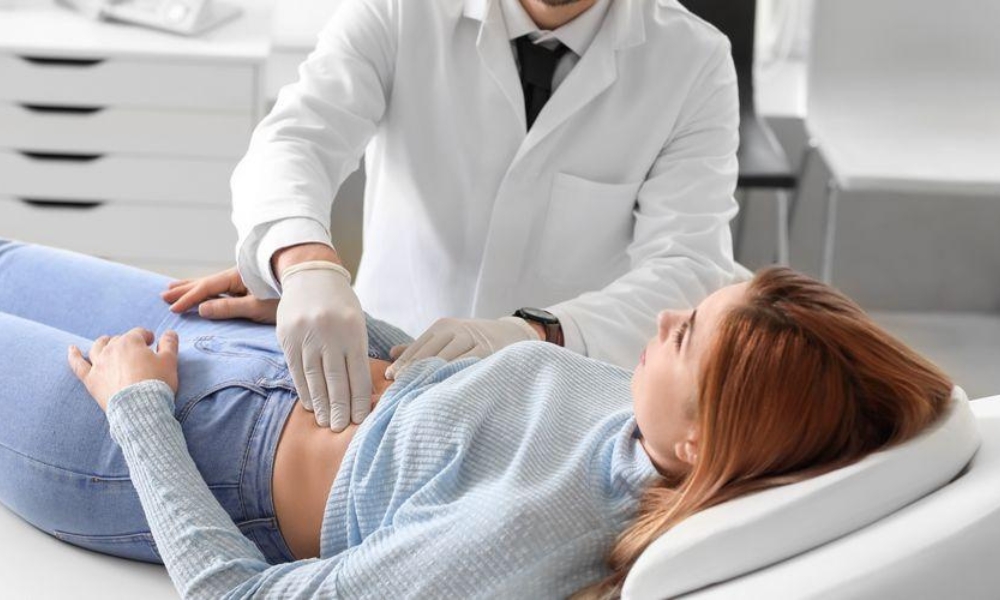 Patient experiencing hernia pain symptoms in the abdomen and groin area